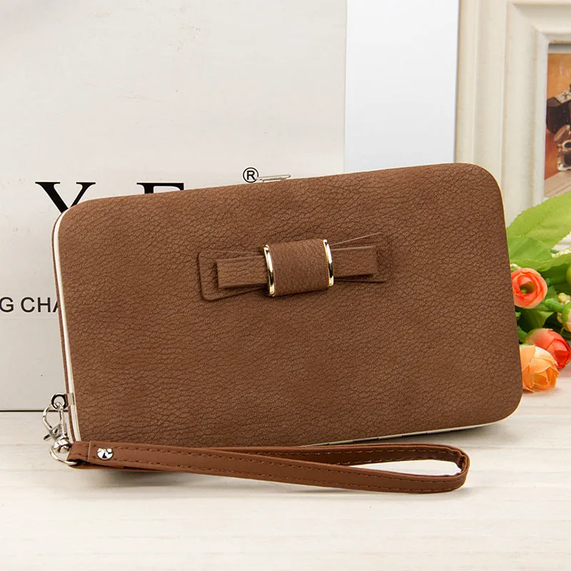 Factory spot low price wholesale new version of women's wallet in the long money bag butterfly knot lunch box woman bag tide