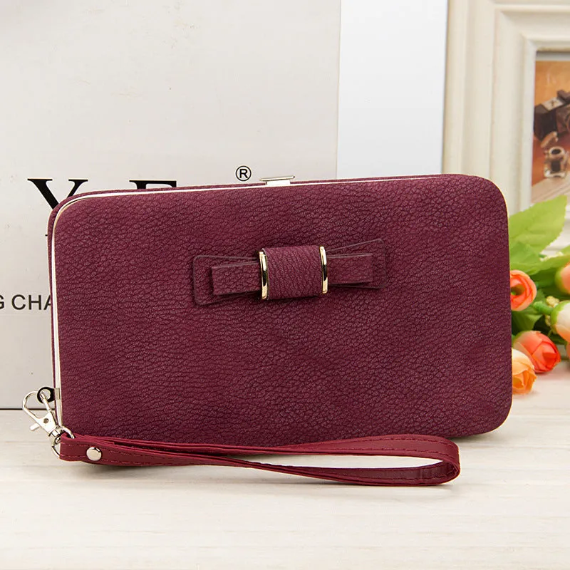 Factory spot low price wholesale new version of women's wallet in the long money bag butterfly knot lunch box woman bag tide