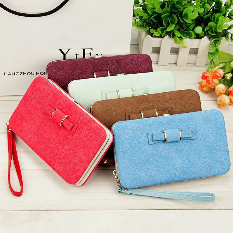 Factory spot low price wholesale new version of women's wallet in the long money bag butterfly knot lunch box woman bag tide