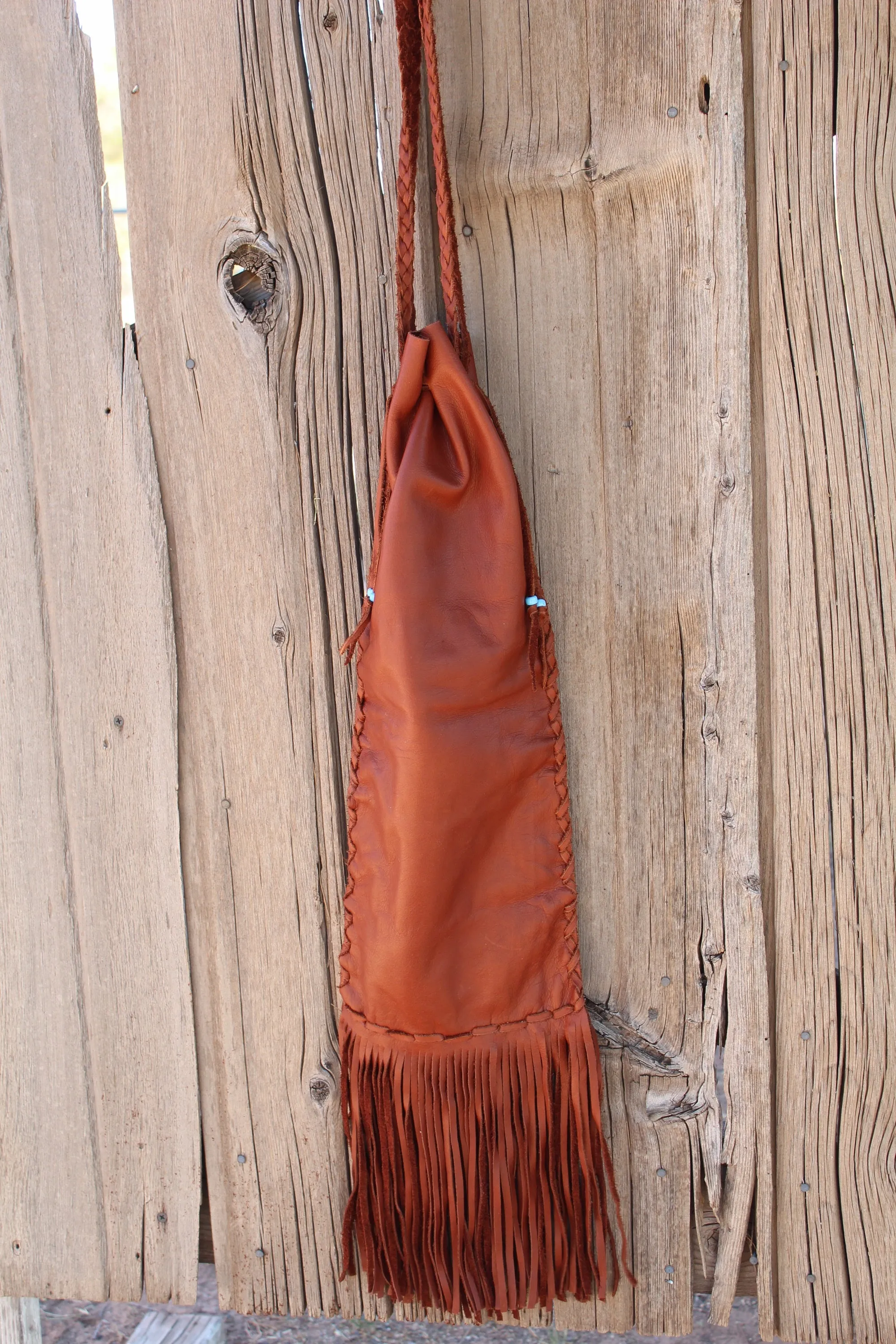 Fringed pipe bag, leather chanupa bag